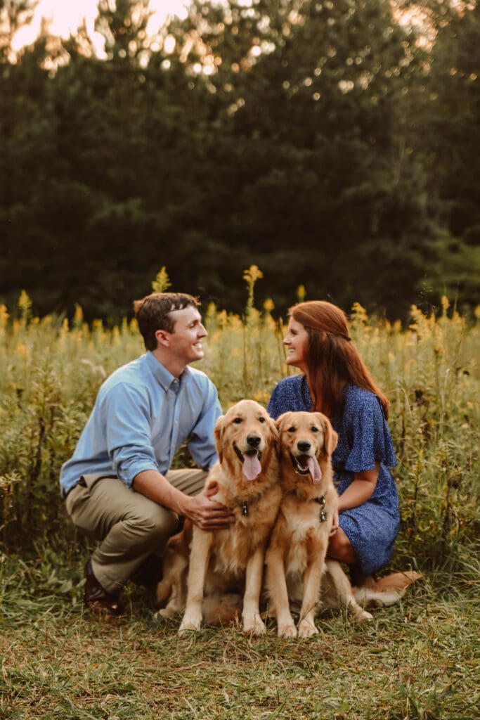 Couples portrait after proposal with golden retrievers by kattie jackson photography