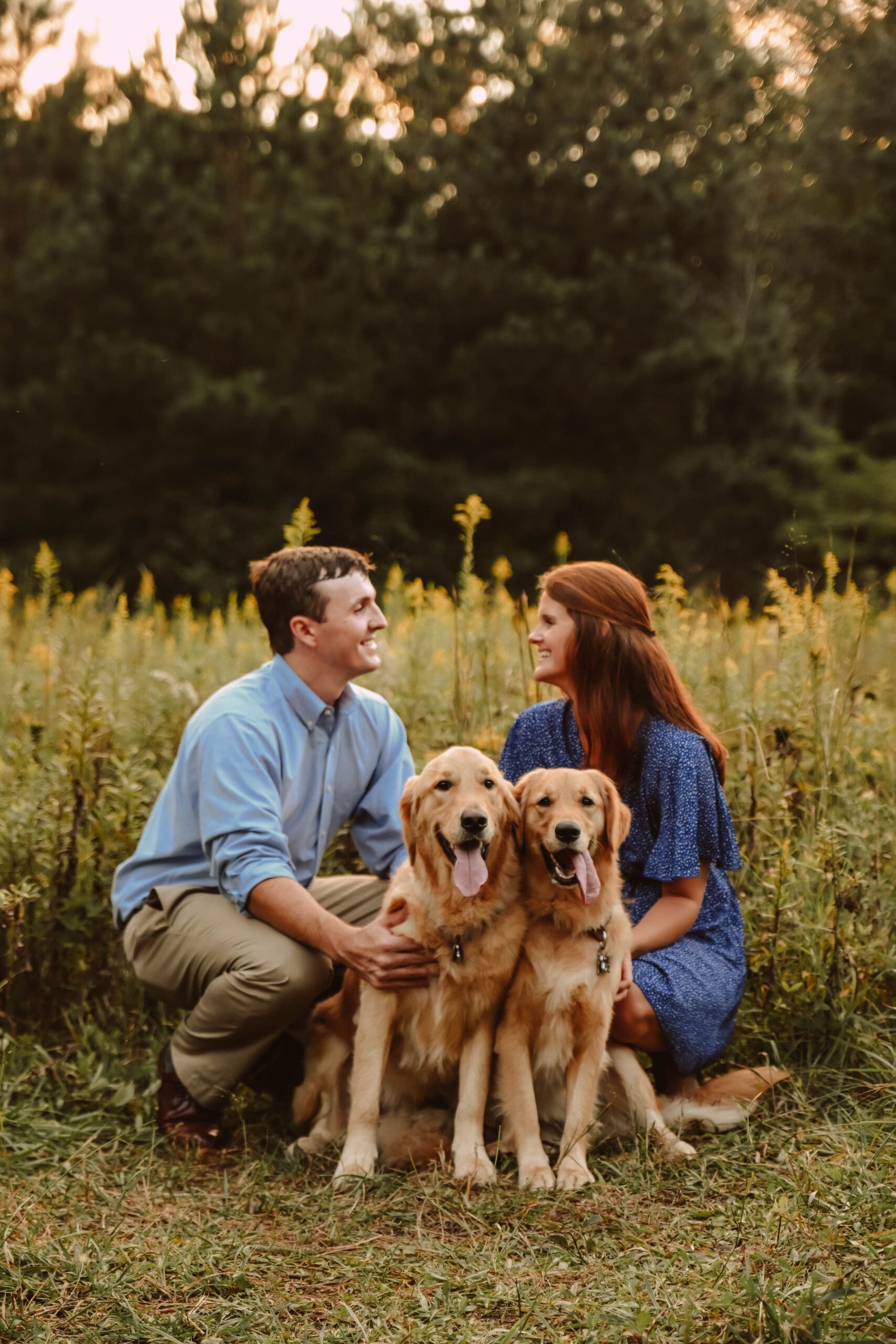 Couples portrait after proposal with golden retrievers by kattie jackson photography