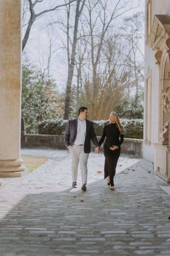 husband wife walking, maternity session at the swan house by kattie jackson photography 